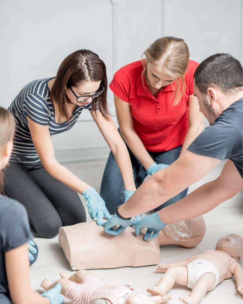 Learners practicing Emergency First Aid At Work skills